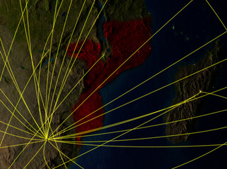 Mozambique from space on model of planet Earth with networks. Detailed planet surface with city lights.
