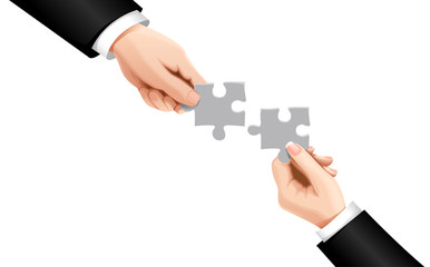 Hands putting puzzle pieces. Teamwork business concept. Teamwork concept. Businessman holds puzzle in hands isolated on background. Cooperation, partnership, working together. Connecting two pieces