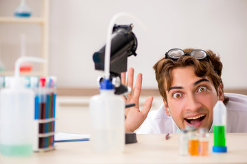 Funny crazy chemist doing experiments and tests