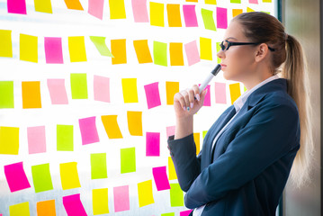 Beautiful female employee with many conflicting priorities 