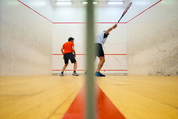 Fototapeta na wymiar Two friends playing squash in Mutilva, Navarra, Spain