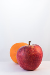 Red apple and orange fruit