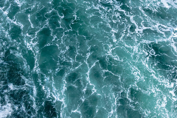 agitated ocean waters from big ship wake