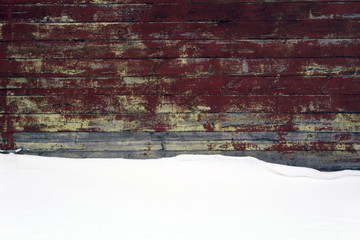 Vintage wooden wall with snow layer