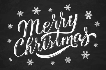 Merry Christmas hand drawn calligraphy lettering surrounded by snowflakes on chalkboard. Holidays vector illustration.