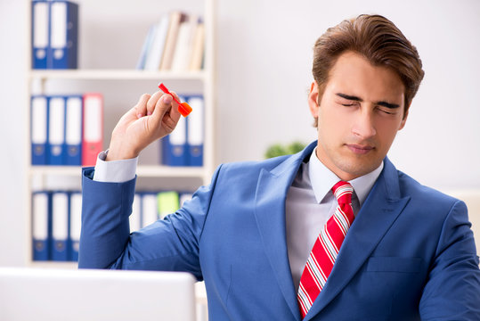 Businessman throwing dart in business concept