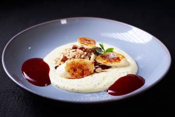 healthy breakfast, granola with banana and berry sauce. proper nutrition, nourishing morning meals