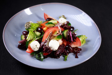 greek salad, traditional recipe, healthy food, continental restaurant menu. vegetable salad with mozzarella and olives