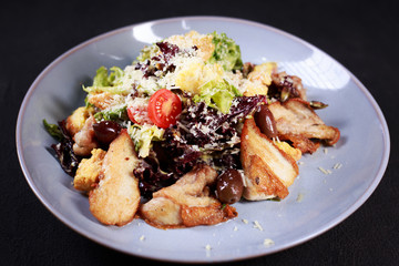 caesar salad, appetizer, gourmet food, banquet, Italian restaurant menu. vegetable salad with fried chicken meat and croutons
