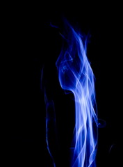 Blue smoke on black background