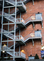 fire escape staircase on the side of a brick building