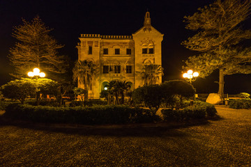 Fototapeta na wymiar Night view of Villa Florio and gardens in Favignana, Sicily. Ignazio Florio was a wealthy industrialist who built an important tuna cannery on the island.
