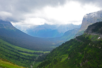 Fototapeta premium Fog lies over the landscape in Glacier National Park.
