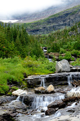 Fototapeta na wymiar Waterfalls from melting glaciers and snow in Glacier National Park.