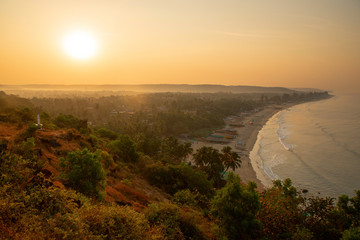 Arambol beach in dawn. Early morning time. Mountain view.