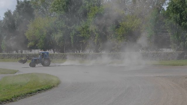 Wheeled tractor blue dub track racecourse old car tires