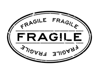Grunge black fragile word oval rubber seal stamp on white background
