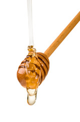 Stick with honey isolated on white background