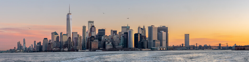 Downtown Manhattan Skyline with Orange Skies during a Winter Sunrise