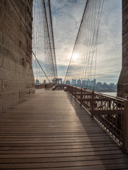 Walking The Brooklyn Bridge During the Early Morning with Cloudy Skies