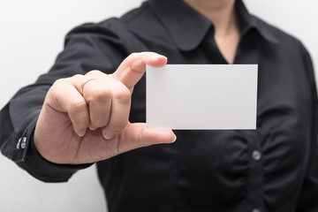 Woman hand holding a business card
