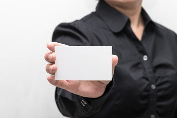 Woman hand holding a business card