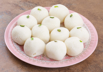 Indian Sweet Rasgulla Also Know as Rosogolla, Roshogolla, Rasagola, Ras Gulla, Anguri Rasgulla or Angoori Rasgulla is a Syrupy Dessert Popular in India. It is Made From Ball Shaped Dumplings