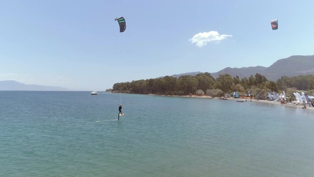 Aerial view of person kitesurfing in the Gulf of Patras, Greece.