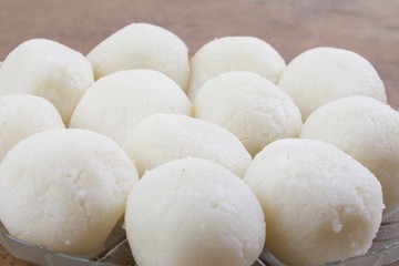 Fototapeta na wymiar Indian Sweet Rasgulla Also Know as Rosogolla, Roshogolla, Rasagola, Ras Gulla, Anguri Rasgulla or Angoori Rasgulla is a Syrupy Dessert Popular in India. It is Made From Ball Shaped Dumplings