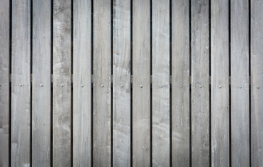 background texture of old wood fence, raw wood fence. vertical planks