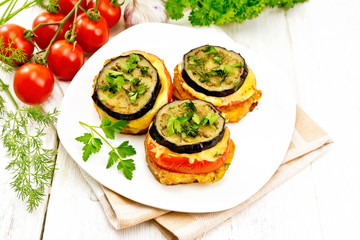 Appetizer of aubergines and cheese in plate on table