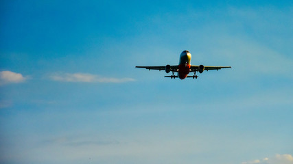 The plane take off against the blue sky and removes the chassis . copy space for text