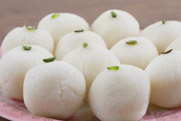 Indian Sweet Rasgulla Also Know as Rosogolla, Roshogolla, Rasagola, Ras Gulla, Anguri Rasgulla or Angoori Rasgulla is a Syrupy Dessert Popular in India. It is Made From Ball Shaped Dumplings
