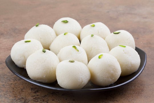 Indian Sweet Rasgulla Also Know as Rosogolla, Roshogolla, Rasagola, Ras Gulla, Anguri Rasgulla or Angoori Rasgulla is a Syrupy Dessert Popular in India. It is Made From Ball Shaped Dumplings