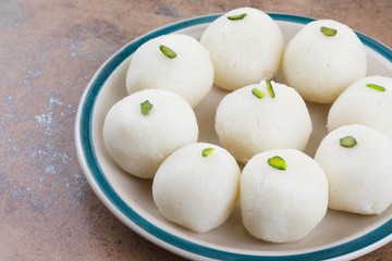 Indian Sweet Rasgulla Also Know as Rosogolla, Roshogolla, Rasagola, Ras Gulla, Anguri Rasgulla or Angoori Rasgulla is a Syrupy Dessert Popular in India. It is Made From Ball Shaped Dumplings