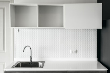 steel sink in modern white kitchen clean interior design