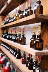 Chemical worker, Chemistry, Experiment, Vials. Close up amber color bottles on the shelf in old perfume laboratory. Flasks and examples of odor in the perfume shop.