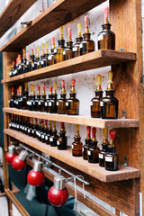 Chemical worker, Chemistry, Experiment, Vials. Close up amber color bottles on the shelf in old perfume laboratory. Flasks and examples of odor in the perfume shop.
