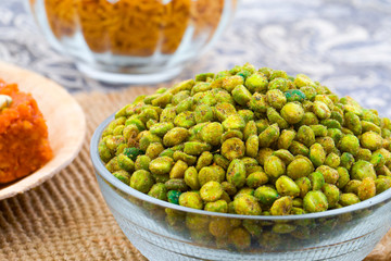 Indian Namkeen Snack Food Masala Green Peas Also Know as Spicy Green Peas, Masala Matar, Hara Matar, Masala Vatana, Spiced Fried Green Peas or Chatpata Matar Serve in Bowl