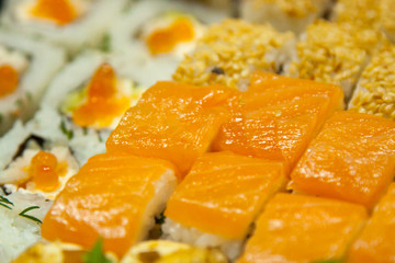 Fototapeta na wymiar close up fresh juicy delicious sushi set. view from the outside. for design and decor. selective focus. background texture.