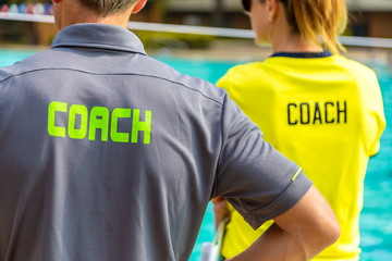 Back view of sport coaches