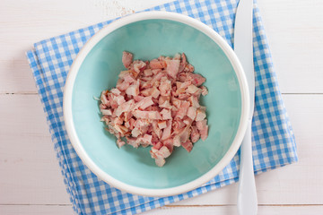 Step-by-step cooking salad with smoked chicken, corn, crackers, step 1 - adding ingredients - smoked chicken, top view, horizontal