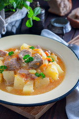 Roast potatoes and turkey meat, selective focus
