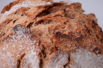Close-up homemade traditional bread on background