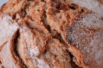 Close-up homemade traditional bread on background