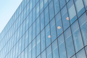 Fototapeta na wymiar Abstract closeup on office Glass building. Urban or business building concept