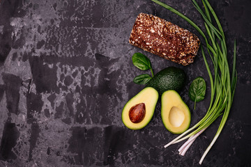 Food, avocado, healthy food. Avocado and brown bread. It can be used as a background