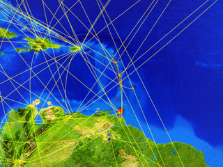 Caribbean from space on model of planet Earth with networks. Detailed planet surface with city lights.