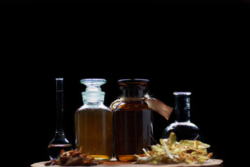 apothecary vintage set of bottles with fluids and herbs