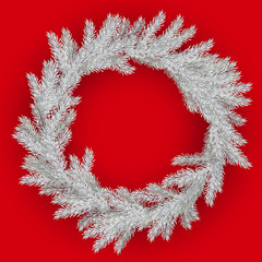 White Christmas wreath on red background. Christmas wreath of pine branches with silver frost.